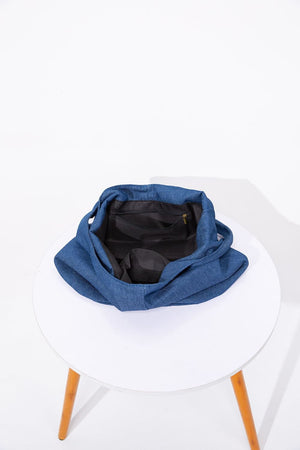 Blue denim shoulder bag with open top and interior pocket.