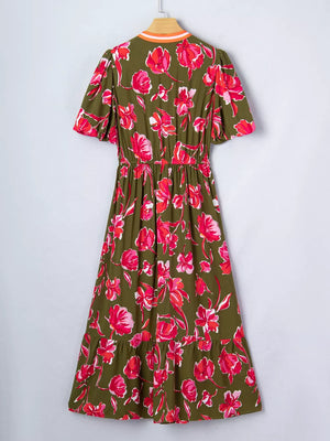 Print split neck dress with short sleeves, elastic waist, and tiered hem in olive green with pink floral print.