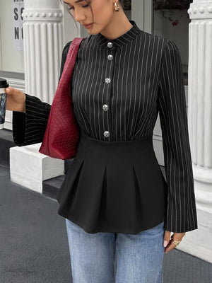 white peplum top featuring decorative button and striped