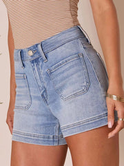 Light blue denim shorts with utility pockets and high waist.