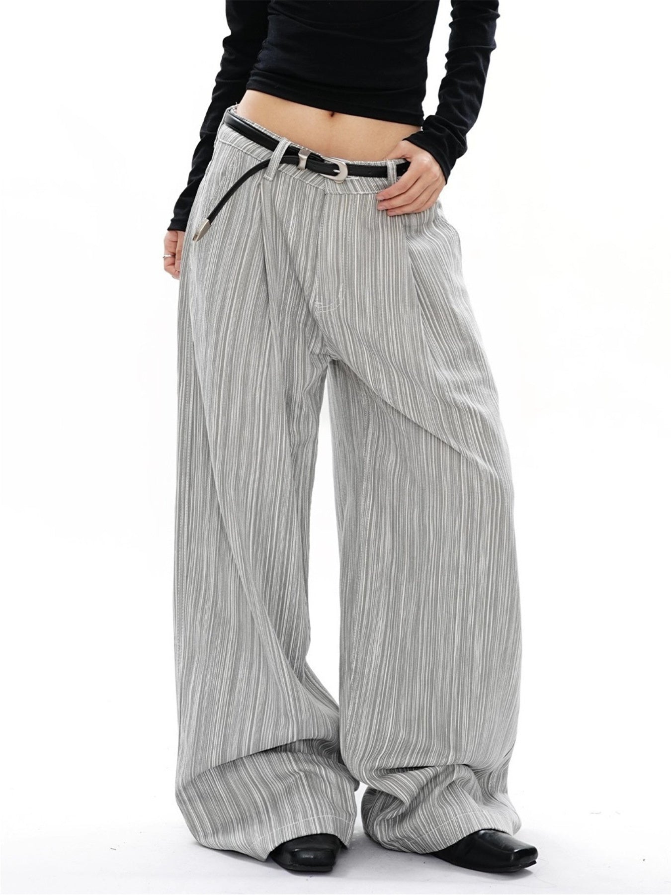 Men's grey striped wide-leg sweatpants with a relaxed fit and pleated texture.