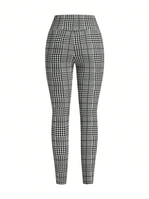 Plaid high waist slim fit ankle length trousers in black and white.