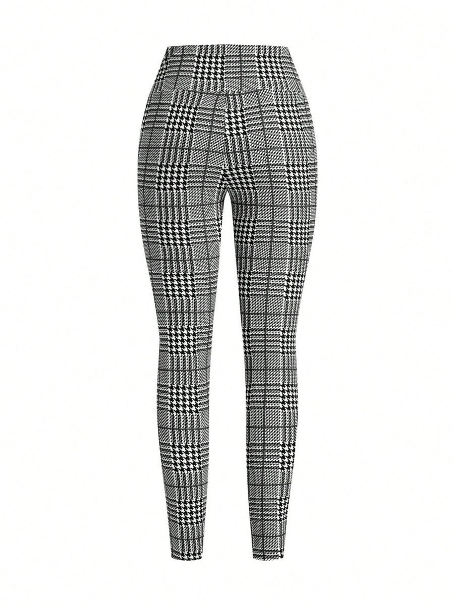 Plaid high waist slim fit ankle length trousers in black and white.