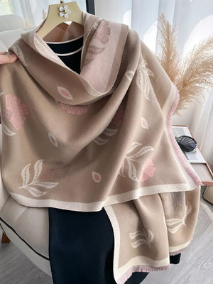 Khaki floral print fringed shawl with pink and white accents and a soft texture.