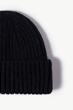 Black chunky ribbed knit beanie with a casual acrylic texture.