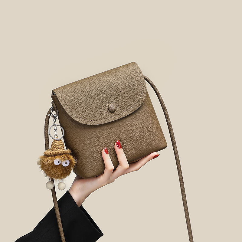 Brown pebbled pu leather crossbody bag with cute fuzzy charm