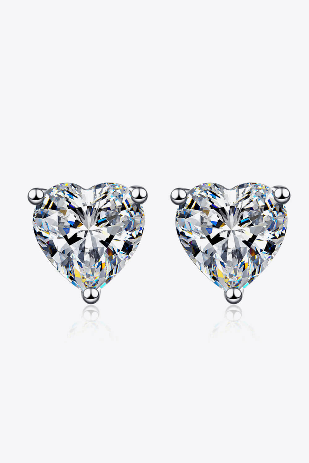 Silver heart-cut moissanite stud earrings with a brilliant sparkle