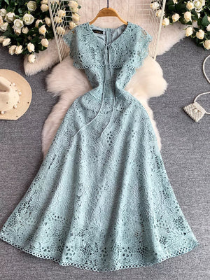 Sky blue lace A-line dress with short flutter sleeves and tie detail at the neckline.