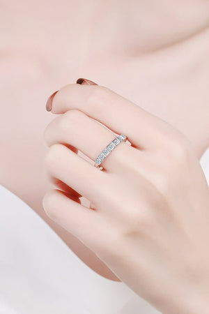 Silver band ring with a row of square-cut clear stones