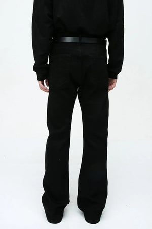 Flared leg black denim jeans with a classic five-pocket design and belt loops.