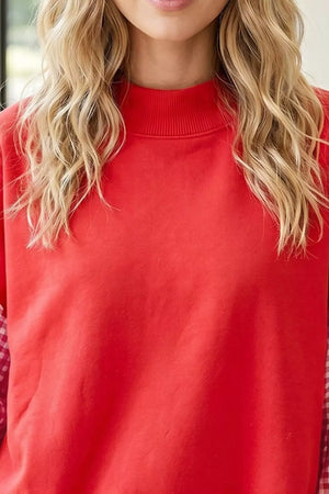 100% polyester Care instructions: Machine wash cold sweatshirt in red with relaxed silhouette