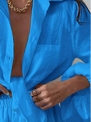 Sky blue relaxed two-piece set with a collared shirt and shorts, featuring a tie-front detail.