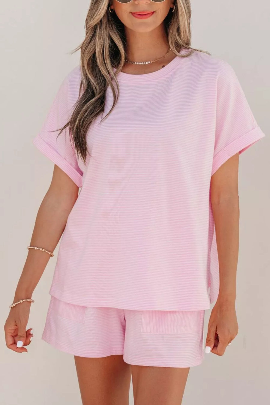 Pink striped cotton oversized tee and shorts set with cuffed sleeves and drawstring waist.