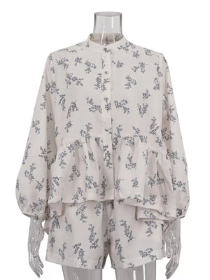 White floral print pajama set with button-up long sleeve top and shorts