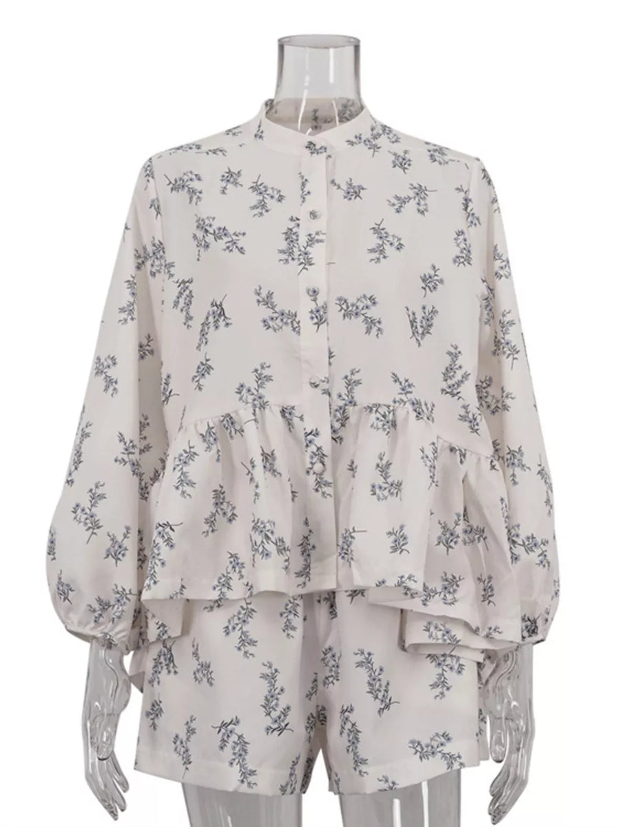 White floral print pajama set with button-up long sleeve top and shorts