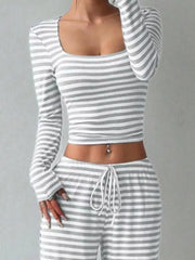 Light gray and white striped crop top with square neck and wide-leg pants with drawstring waist.
