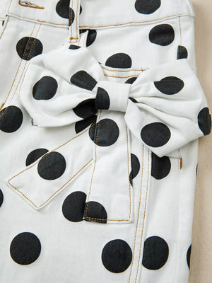 White polka dot denim jeans with a large bow detail on the front.
