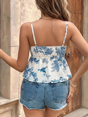 White and blue floral tie-front cami top with adjustable straps and smocked back detail.