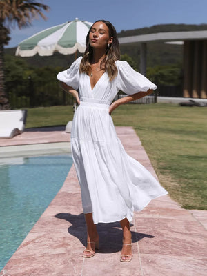 White puff sleeve midi dress with V-neck and tiered skirt.
