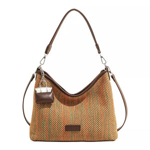 crossbody bag featuring striped in green with Straw weaving Imported Size &amp texture