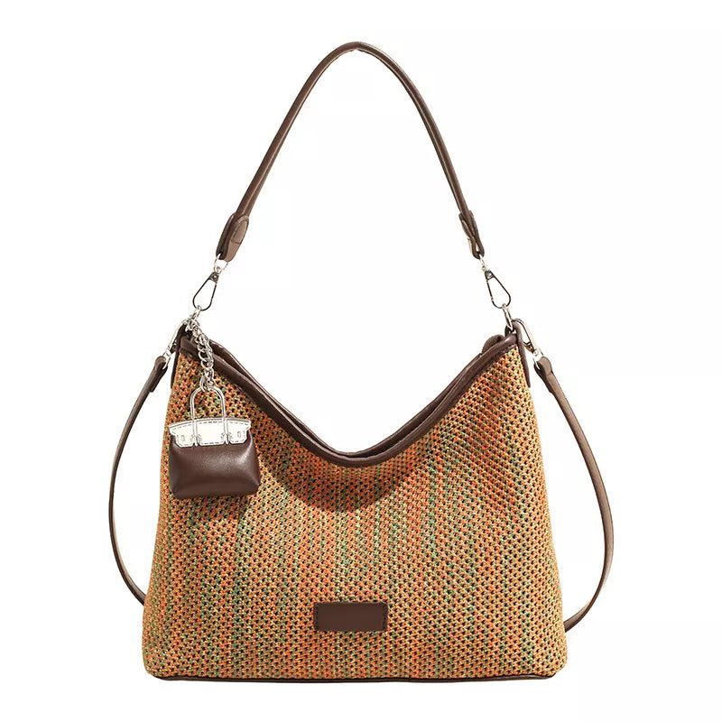 crossbody bag featuring striped in green with Straw weaving Imported Size &amp texture