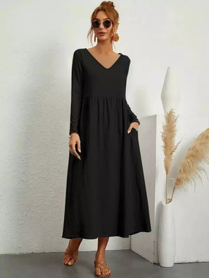 Black midi dress with V-neck, long sleeves, and pockets.