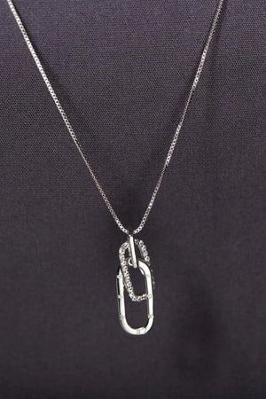 Silver linked pendant necklace with zirconia accents on a delicate chain.