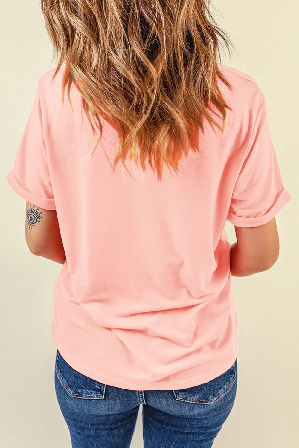 Watermelon pink basic tee with rolled short sleeves and a round neckline.