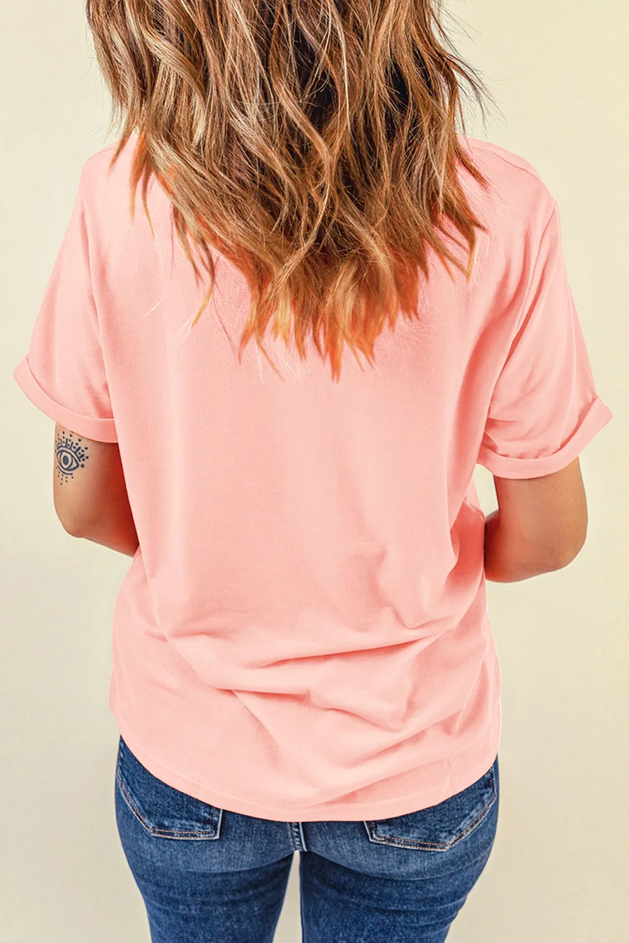 Watermelon pink basic tee with rolled short sleeves and a round neckline.