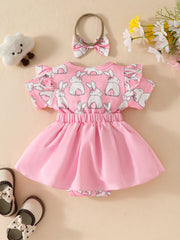 Pink baby dress set with bunny print, flutter sleeves, and matching bow headband.