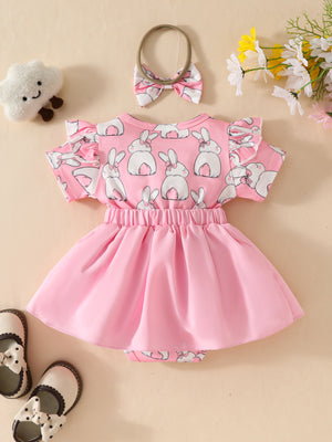 Pink baby dress set with bunny print, flutter sleeves, and matching bow headband.