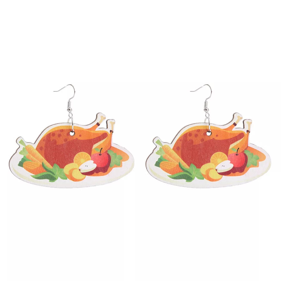 Dangle earrings featuring a roasted turkey dinner with carrots and apples on a white platter.