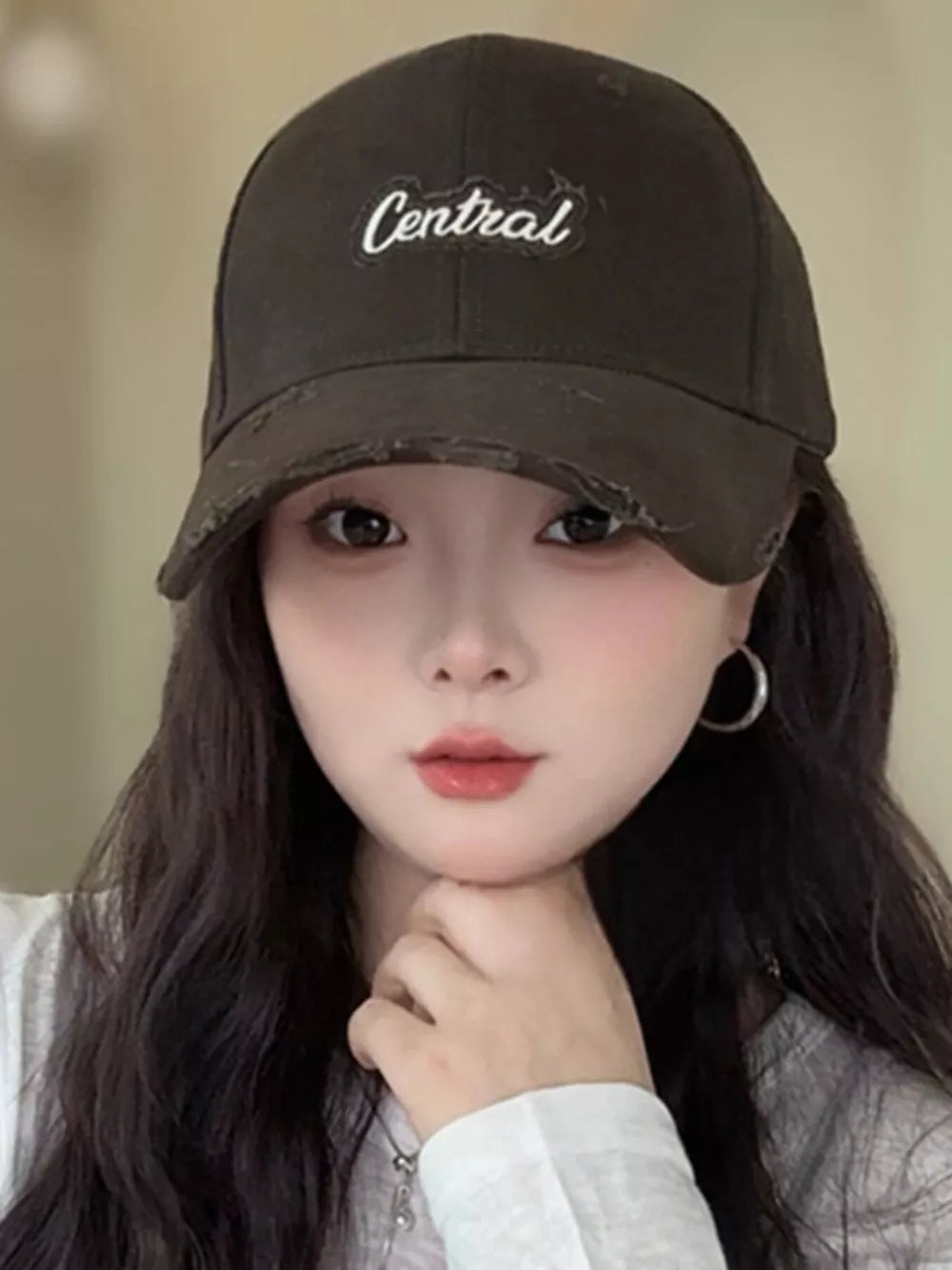 Brown distressed baseball cap with white embroidered "Central" text
