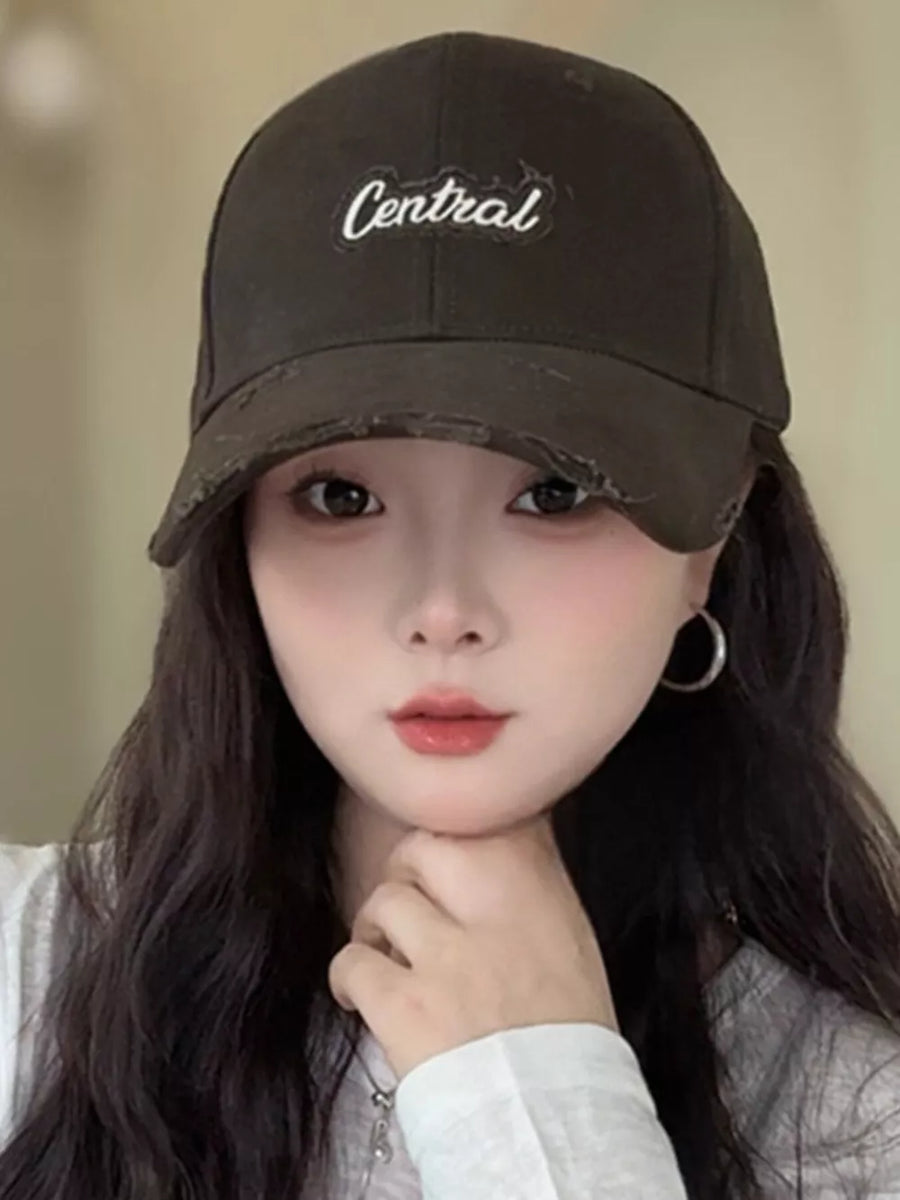 Brown distressed baseball cap with white embroidered "Central" text