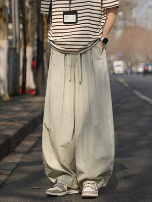 Plus size sweatpants in apricot with a relaxed fit and drawstring waist.