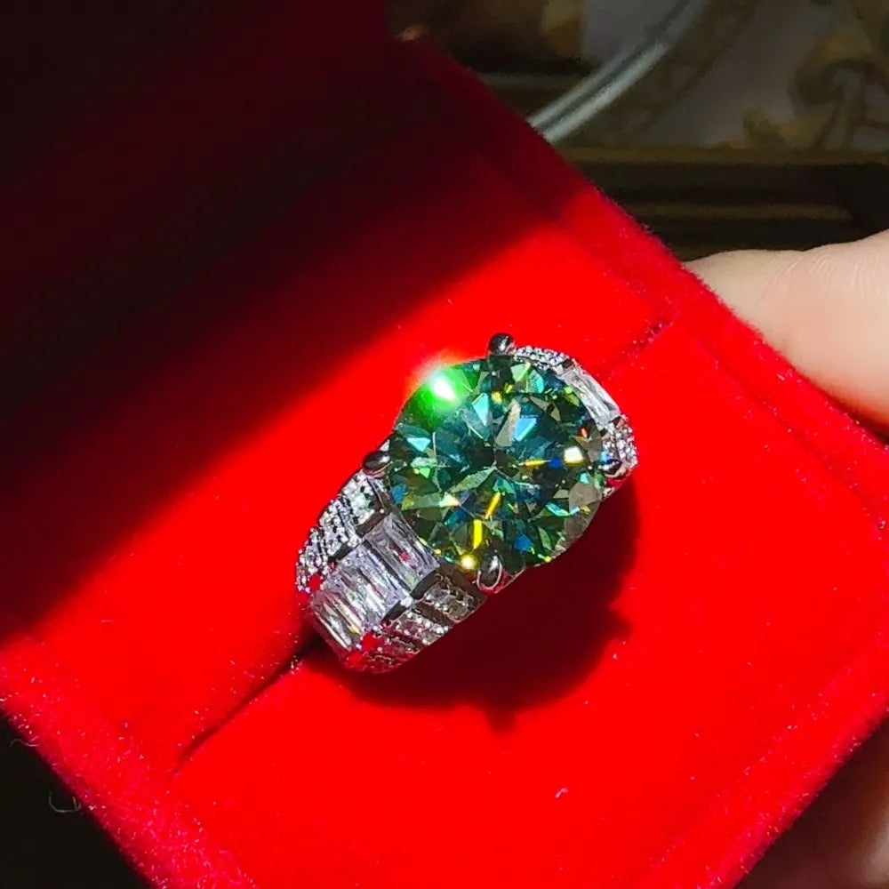 Silver band ring with large emerald cut moissanite and baguette accents.