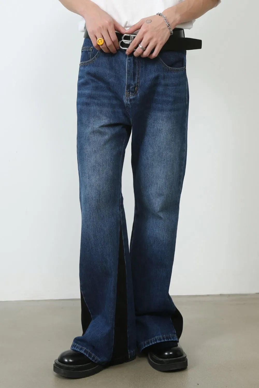 Contrast panel bootcut denim trousers in medium blue with black side panels.