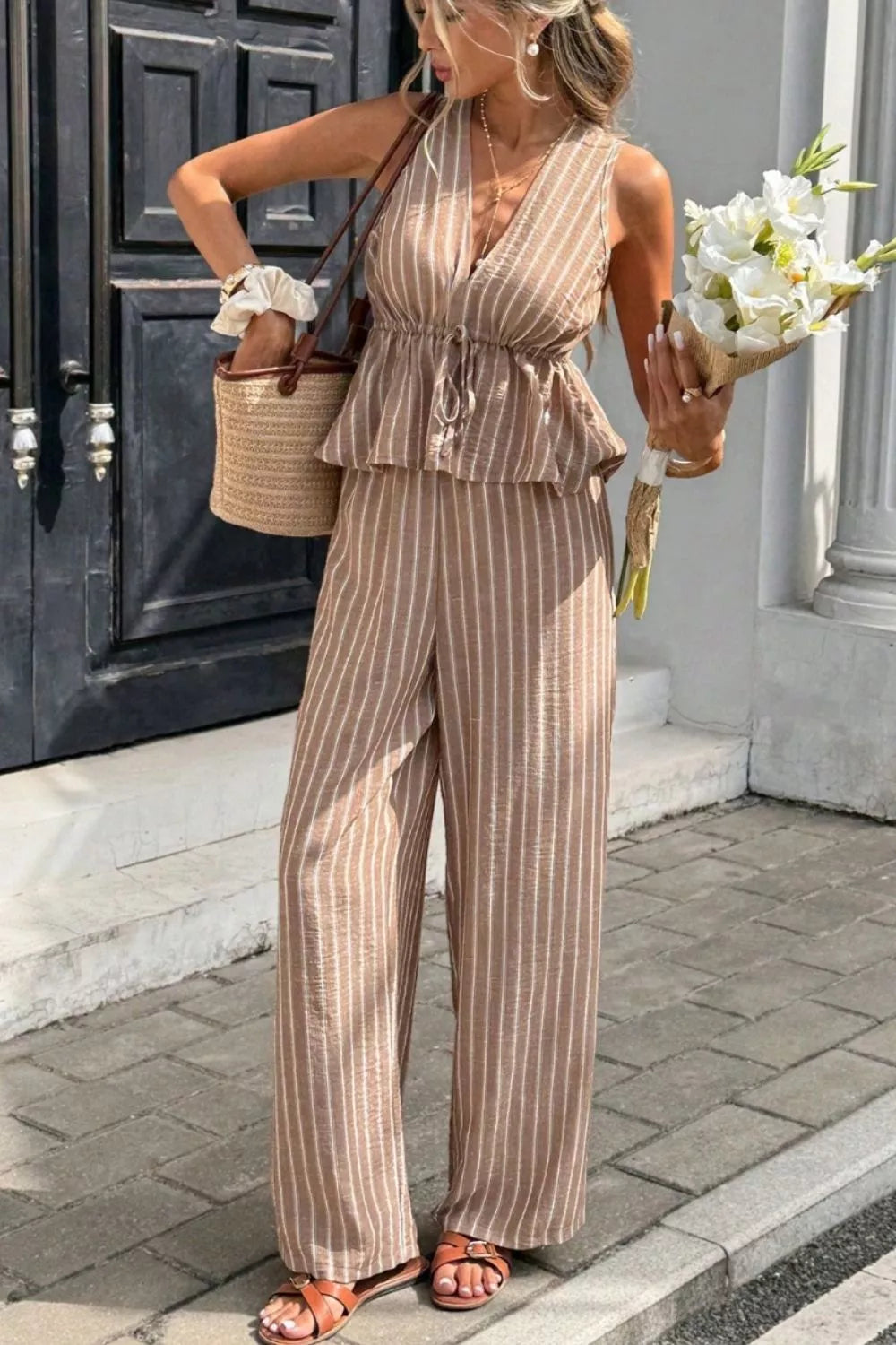 Chic striped two-piece set in camel with peplum top and wide-leg pants.