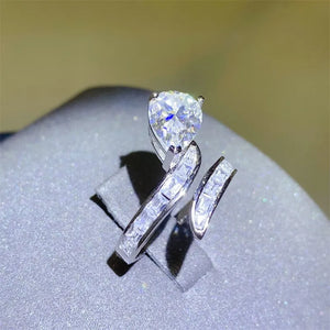 Silver bypass ring with pear cut diamond and baguette accents