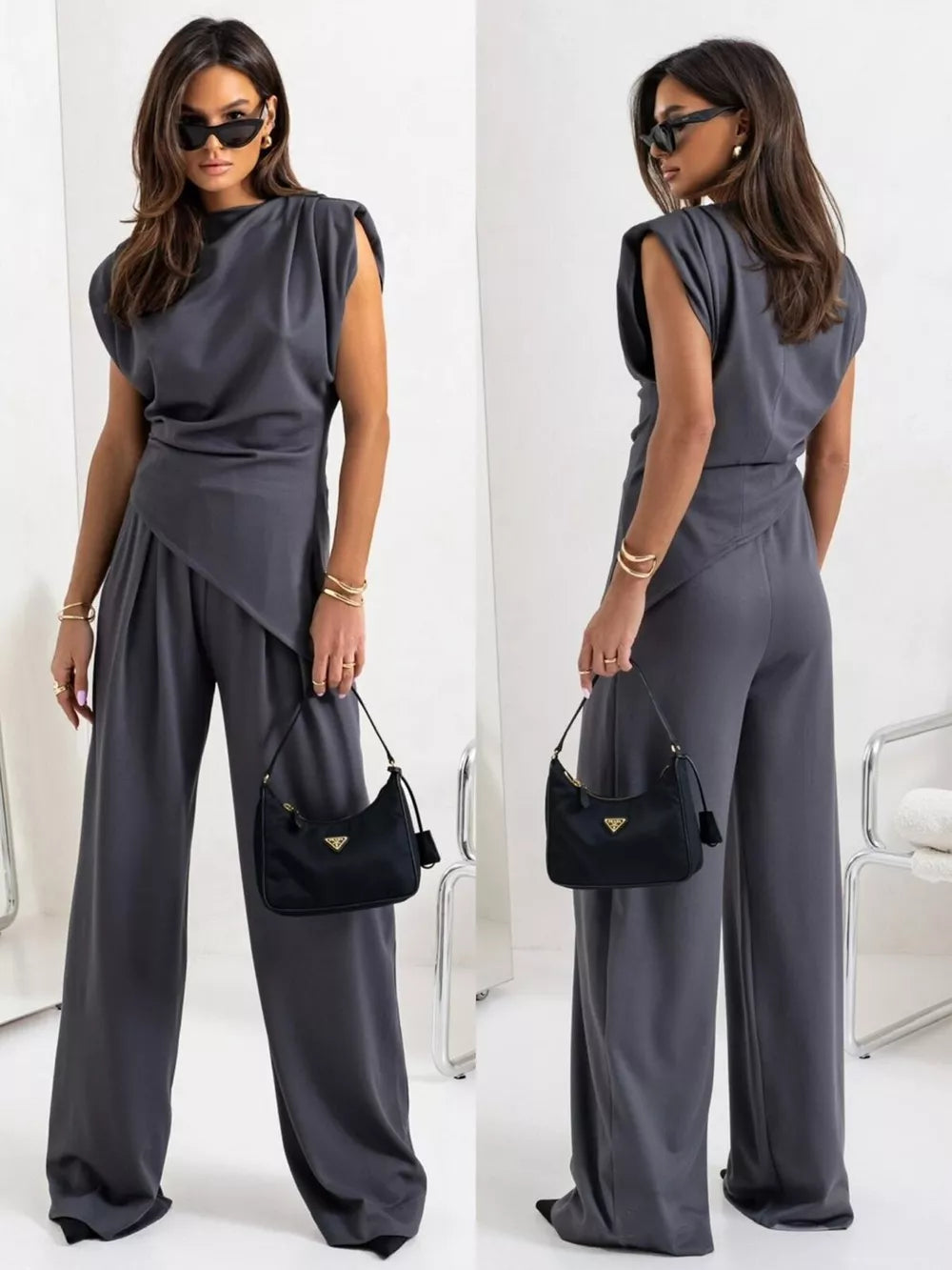 Gray satin cowl neck two-piece set with wide-leg pants and padded shoulders.