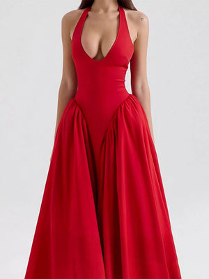 Deep red halter neck midi dress with plunging V-neck and voluminous skirt.