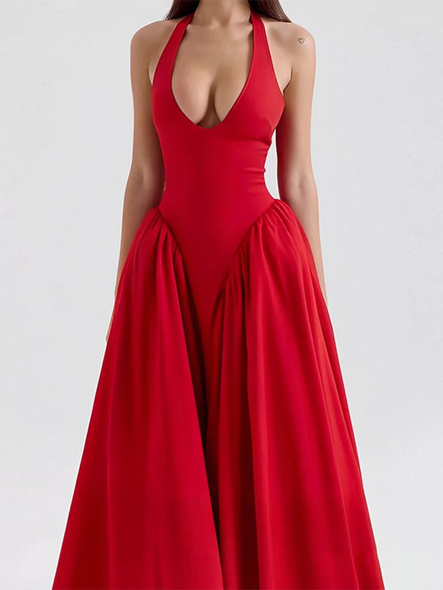 Deep red halter neck midi dress with plunging V-neck and voluminous skirt.