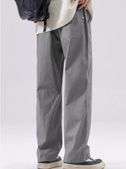 Men's grey casual wide-leg sweatpants with a relaxed fit and pocket detail.