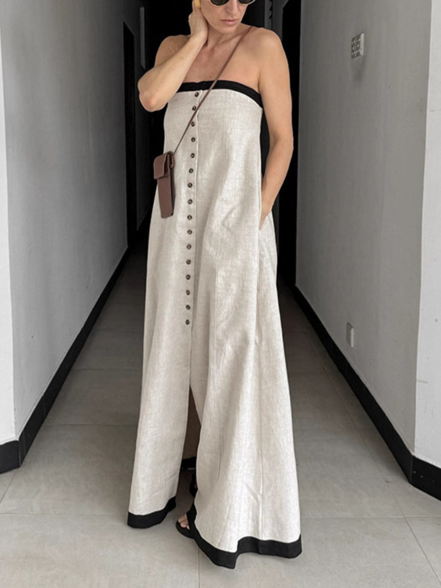 Button front tube maxi dress in beige cotton blend with black trim and side pockets.