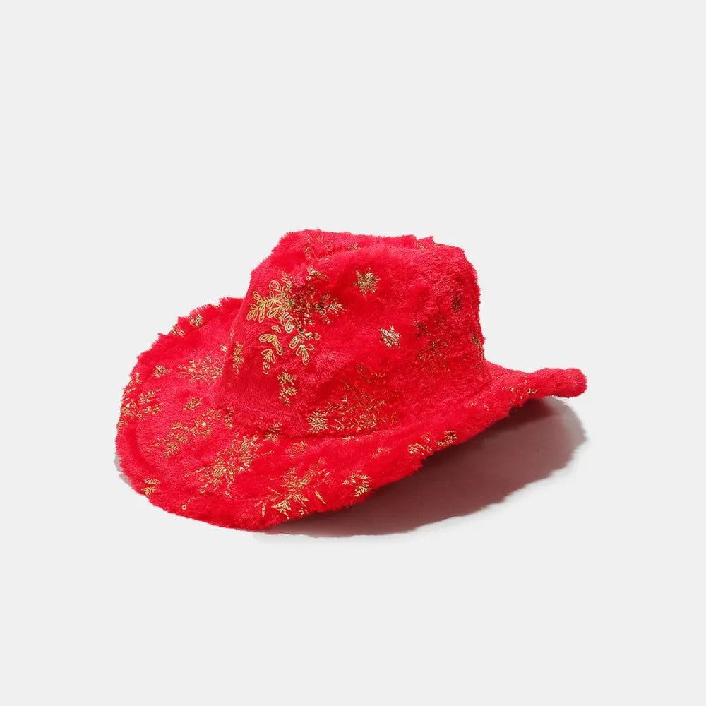 Crimson faux fur cowboy hat with gold snowflake pattern.
