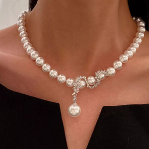Synthetic Pearl,Alloy,Zircon Care instructions: Avoid wearing during exercise, a necklace in silver with fitted silhouette