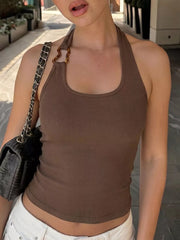 Brown ribbed halter tank top with scoop neck and tortoise ring detail.
