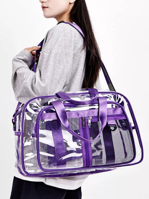 Clear duffel bag with purple trim and straps, featuring mesh side pockets and zippered compartments.