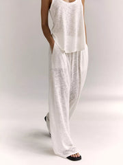 White cropped tank and wide-leg lounge pants set with pockets.