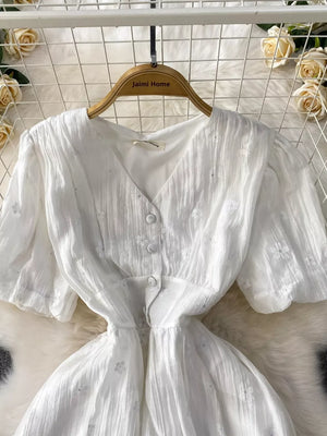 White embroidered puff sleeve midi dress with button front and V-neck